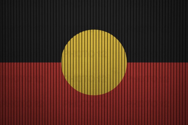 Australian Aboriginal flag painted on the cracked grunge concrete wall