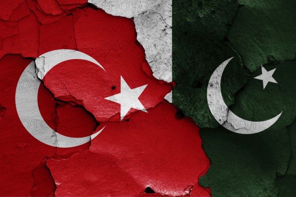 Flags of Turkey and Pakistan painted on cracked wall