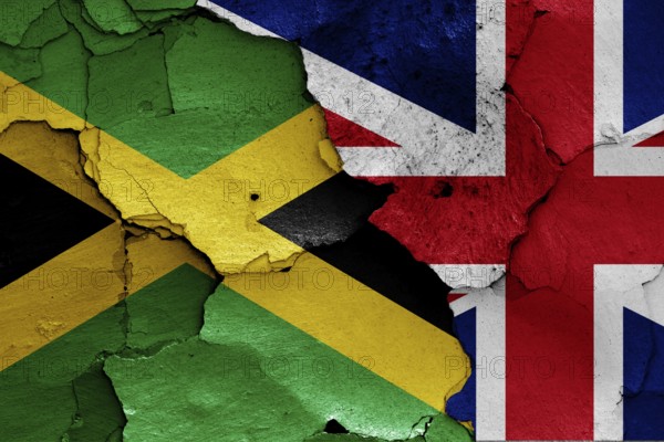 Flags of Jamaica and UK painted on cracked wall