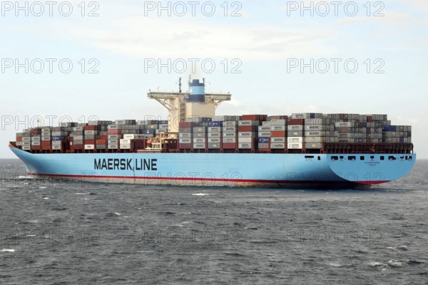 Large Maersk Line container ship loaded on the high seas under a bright blue sky, Morocco, Africa