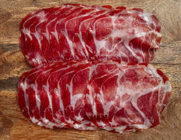 Sliced cured ham, prosciutto, italian dish, delicacy, parma ham, top view, no people