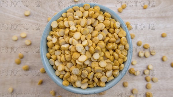Flat Lay of Split Chickpeas Lentils in a Blue Bowl, Top View