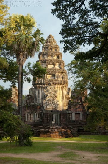 The complex at Phimai dates originally from the reign of Surayavarman II (r. 1113 - 1150), during the first part of the 12th century CE. The temple was constructed with white, finely-grained sandstone, in the same style as Angkor Wat. Like Angkor, too, Phimai was first dedicated to the cult of Vishnu. The central sanctuary tower and much of the immediate surrounding which survive today date from this early period.<br/><br/> About one hundred years later, when Jayavarman VII (r. 1181 - 1218), 'the builder', extended and developed Phimai, the temple became a Mahayana Buddhist centre, dedicated to the Vimaya Buddha. The name 'Phimai' is derived from this.<br/><br/> The basic structure of Jayavarman's city is readily identifiable today. The complex sits in a large rectangle which once contained a small town, and was surrounded on all four sides by water – the Mun River to the north, a natural canal to the west, and two man-made canals to the south and east. The south wall of the city was p...