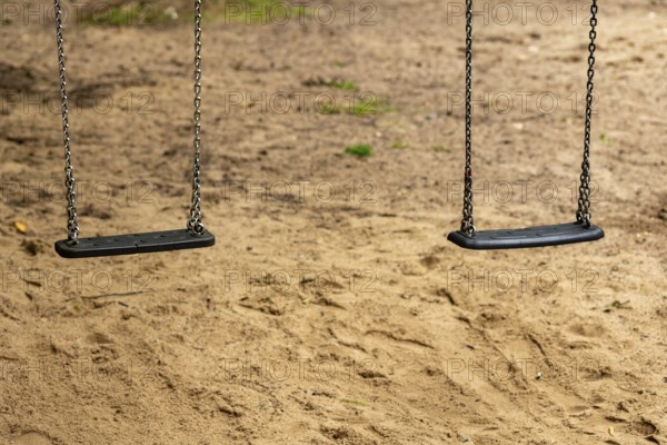 2 swings on a children's playground