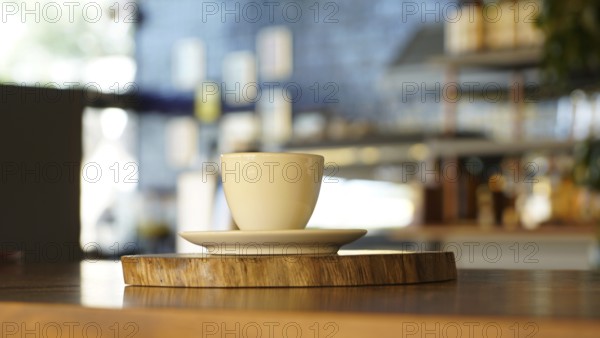 A cup of coffee with a blurred background in a cozy, warm-toned cafe, ISTANBUL, TURKEY