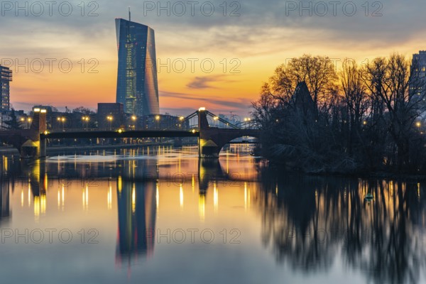 View across the Main to the ECB. Sunrise in the background of the buildings. Taken in the morning in Frankfurt am Main