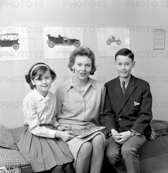 Gullan Marianne, Princess Bernadotte, Countess of Wisborg (née Lindberg, later Tchang, born 15 July 1924), also known as Princess Marianne Bernadotte, is a Swedish actress, fashion icon and philanthropist who in 1961 married Sigvard Bernadotte, the second son of Gustaf VI Adolf of Sweden. Here with their children Robert Gabriel Bobbe and Marie Gabrielle Marielle at home on March 25, 1962. Conard ref 4598