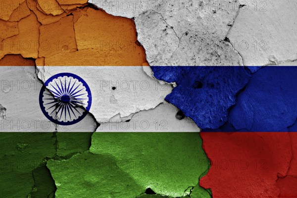 Flags of India and Russia painted on cracked wall