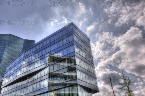 Modern building with glass facade in front of a cloudy sky and reflecting light, Prime Tower Zurich, HDR artistic, Zurich, Canton of Zurich, Switzerland, Europe