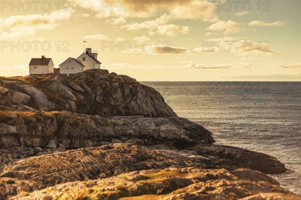 Serene cliffside view with houses overlooking the ocean under a sunny sky, mountains, rocks, road, sea, ocean, water, nature, couds, vilage, Lofoten Islands, Norway, Norge, Europe