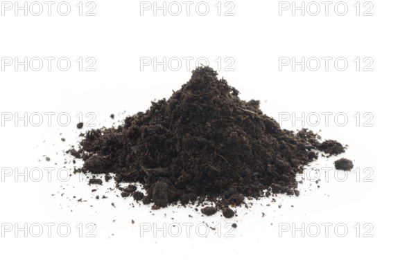 Organic potting soil mix enriched with compost, used in horticulture and gardening. Closeup of an isolated cone pile on white studio background