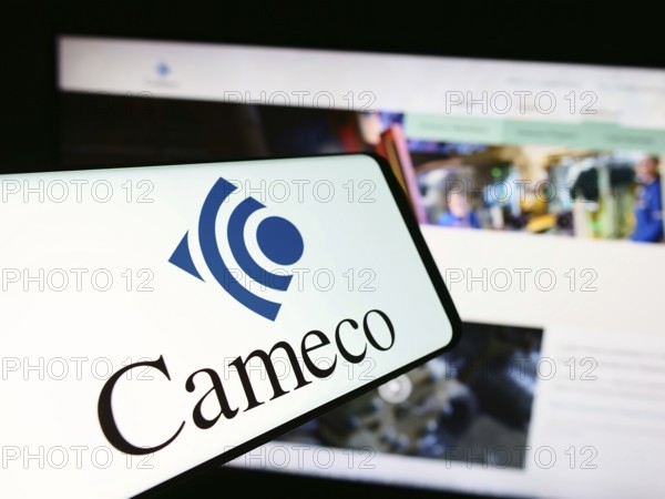 Stuttgart, Germany, 07-21-2024: Mobile phone with logo of Canadian uranium mining company Cameco Corporation in front of business website. Focus on center of phone display, Europe