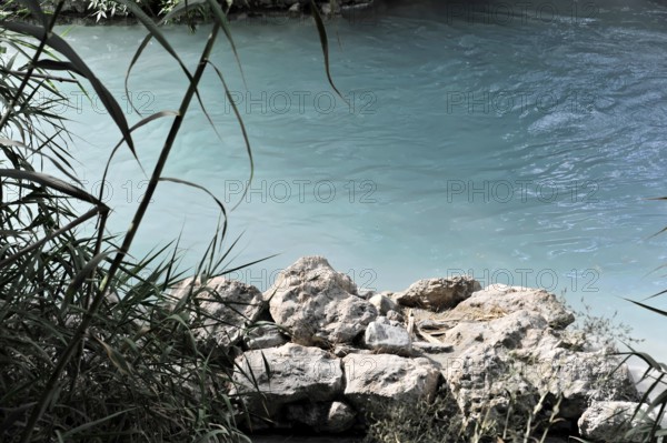 Clear river with natural stones and surrounded by lush plants, Terme di Saturnia, Cascate del Molino, waterfall, thermal spring, sulphurous thermal water, Saturnia, Province of Grosseto, Tuscany, Italy, Europe