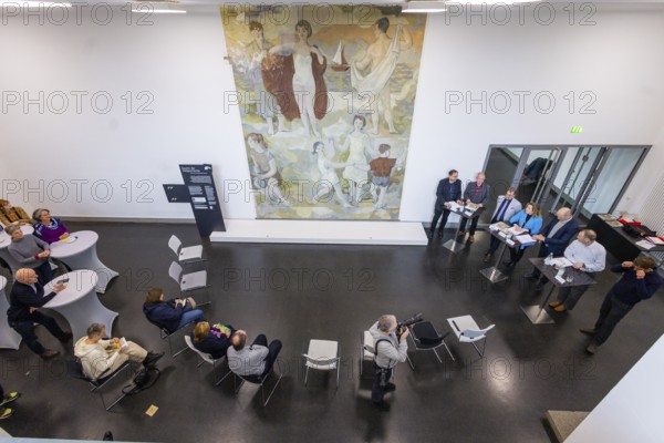 The partial uncovering of the early work in the Deutsches Hygiene-Museum has been completed In the south stairwell foyer of the Deutsches Hygiene-Museum, the large-format mural Lebensfreude (Joy of Life) was created in 1956, with which the then 24-year-old Gerhard Richter completed his studies at the Dresden Academy of Fine Arts. This diploma work, measuring around 63 square metres, was painted over in 1979 and then largely forgotten. After two smaller windows had already been opened in the 1990s, a central section of this historically significant work of art has been uncovered since February 2024 with Gerhard Richter's consent. The result of this complex restoration project can now be viewed. The uncovering was a joint project of the Deutsches Hygiene Museum and the Wüstenrot Foundation in co-operation with the Dresden University of Fine Arts. The accompanying educational measures were supported by the Ernst von Siemens Art Foundation through a
