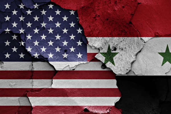 Flags of USA and Syria painted on cracked wall