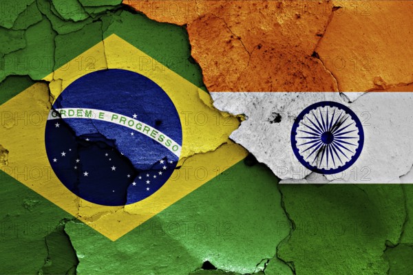 Flags of Brazil and India painted on cracked wall