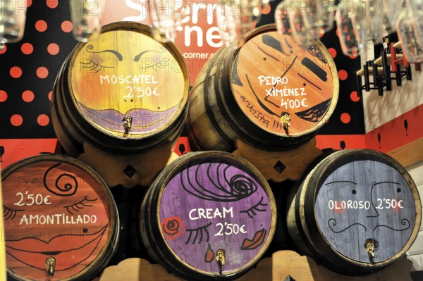 Madrid, Spain, Europe, wooden barrels with colourful painting and price indications in an interior, Europe