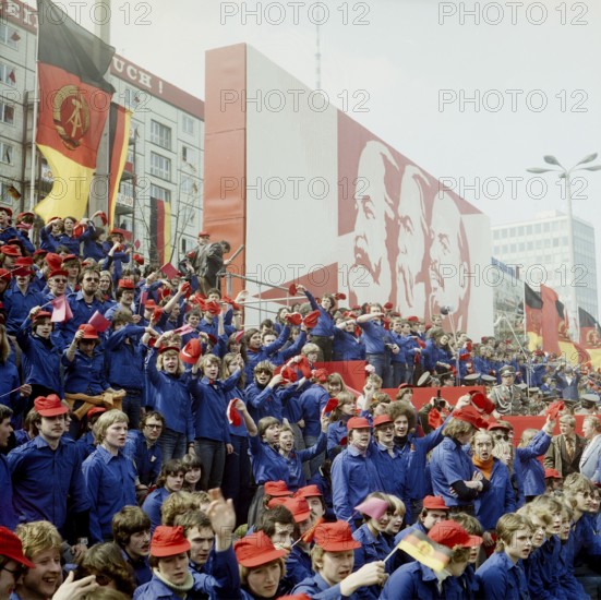 1980050168, East Berlin, 01.05.1980, Karl-Marx-Allee, cheering young members of the Free German Youth on the counter grandstand opposite the grandstand of honour at the May Day demonstration in East Berlin, GDR GDR