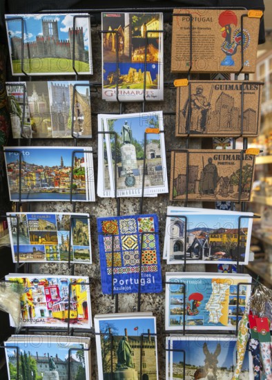 Display rack of colour picture postcards outside shop, city of Guimaraes, northern Portugal