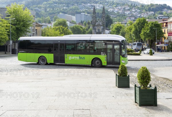Bus passing Santos Passos Church, Largo da República do Brasil, Campo da Feira, city of Guimaraes, northern Portugal