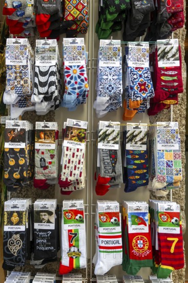 Souvenir gift shop display rack of novelty socks, Guimaraes, northern Portugal