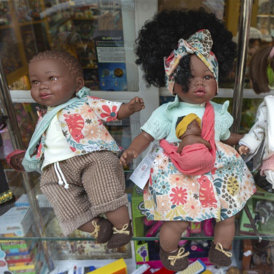 Black skinned baby dolls on display in shop window, city of Guimaraes, northern Portugal