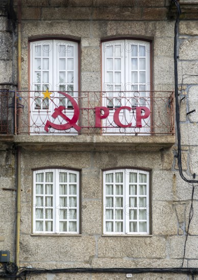 Hammer and sickle sign on PCP Portuguese Communist Party building, city centre Guimaraes. Portugal