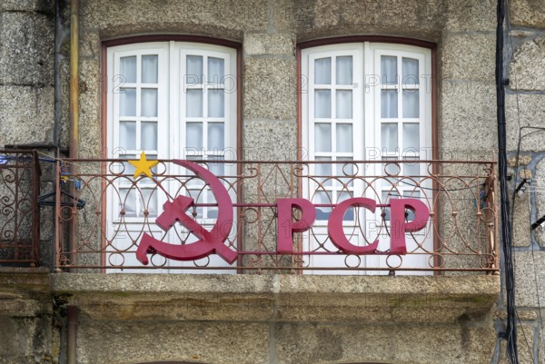 Hammer and sickle sign on PCP Portuguese Communist Party building, city centre Guimaraes. Portugal