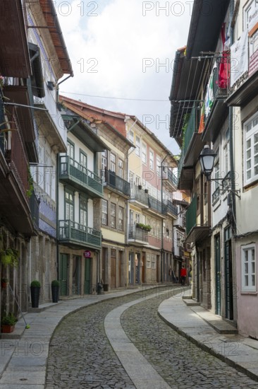 Street of historic buildings with balconies, Rua Egas Montiz, city centre Guimaraes, northern Portugal