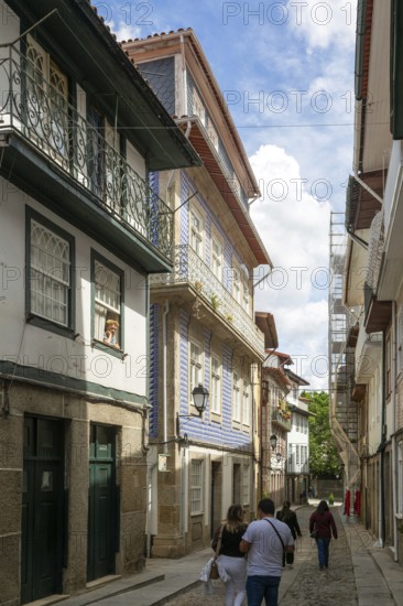 Street of historic buildings with balconies, Rua Egas Montiz, city centre Guimaraes, northern Portugal