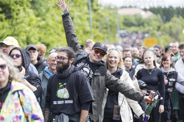 Festival visitors in front of the main entrance at the Rock am Ring Festival on Friday, Nürburgring race track race track, 06.06.2025
