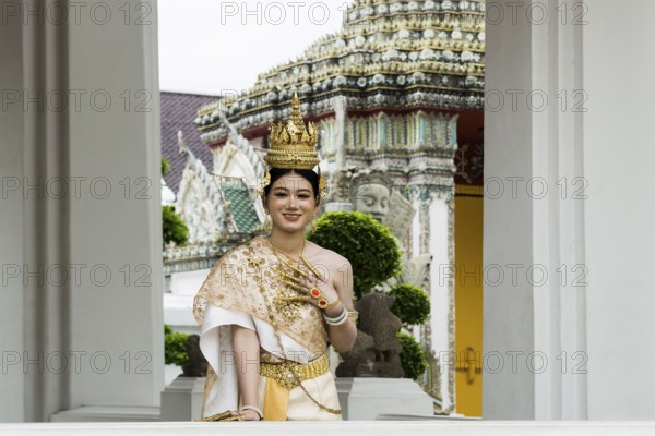 Thai traditionally and festively dressed young woman, Wat Pho, Bangkok, Thailand, Asia