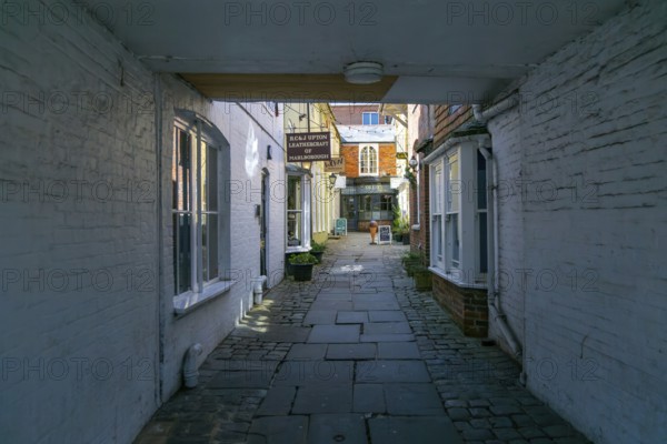 Specialist shops in Old Hughenden Yard alleyway, Marlborough, Wiltshire, England, UK