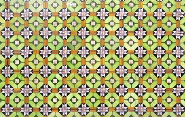 Bright colourful pattern of ceramic tiles on wall of house, Rua das Trinas, Guimaraes, northern Portugal