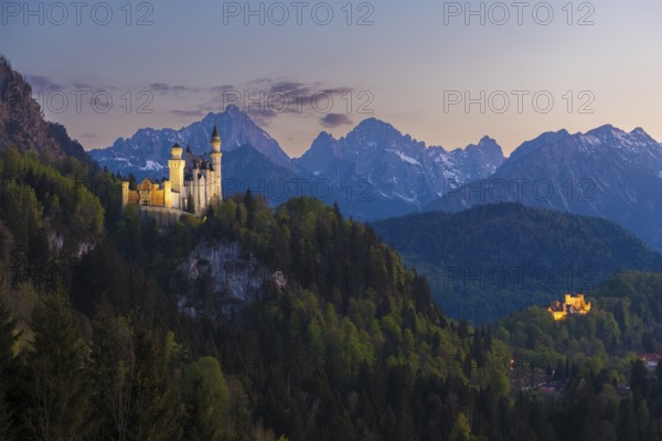 Two castles in an idyllic mountain landscape at sunset, Neuschwanstein, Hohenschwangau, Schwangau near Füssen, Ostallgäu district, Swabia, Bavaria, Germany, Europe