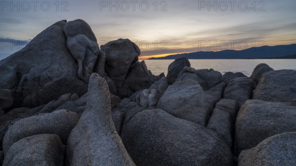 Sunset, rocky coast near Porto Pollo, Corsica, France, Europe