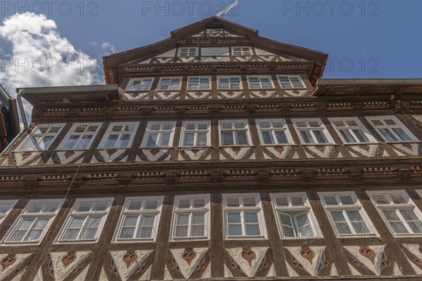 The Bürgersche Haus from 1639, symmetrical half-timbered house with attached dwarf house, Bad Sooden, Allendorf, Allendorf district, historic old town under monument protection, Kirchstrasse 29, most important half-timbered house, decorations, hearts, blue sky, clouds, Werra-Meissner district, Hesse, Germany, Europe