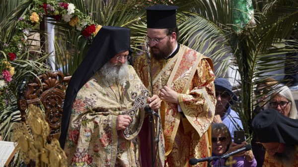 Two priests in rich robes stand in the middle of a solemn ceremony with religious symbols and palms, Orthodox ceremony, monks of St John's Monastery, ceremonial washing of feet, procession, Maundy Thursday, Megali Pempti, Chora, Patmos, Dodecanese, Greek Islands, Greece, Europe