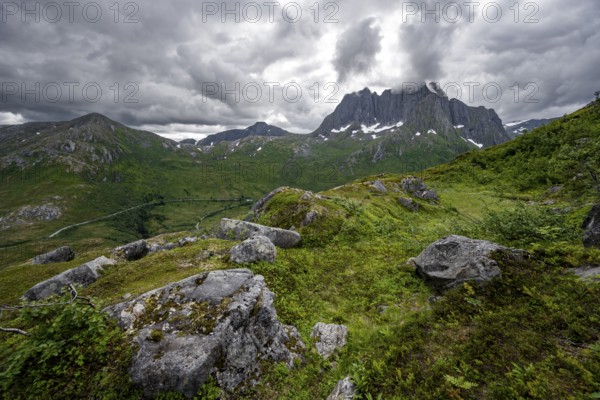 View of mountain landscape, hike to the summit of Barden, behind mountain peak Breidtind, Senja, Norway, Europe