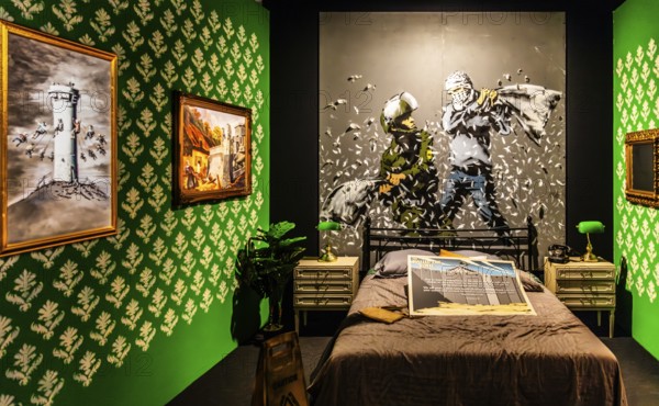 Banksy - The Walled Off Hotel, ironically artistically designed rooms right next to the controversial wall, 2023, Bethlehem, West Bank, exhibition The World of Banksy