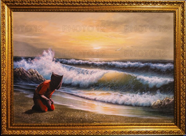 Banksy - Guantanamo Bay, Crude Oils, Haeftling in contrast to the idyllic seascape, 2005, exhibition The World of Banksy