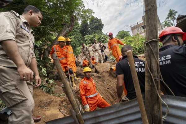 Rescue operations by the National Disaster Response Force (NDRF) and police are in full swing after a major landslide, triggered by a heavy downpour, in Guwahati, India, on June 7, 2025. One person was reported missing in thr landslide and two houses damaged, Asia