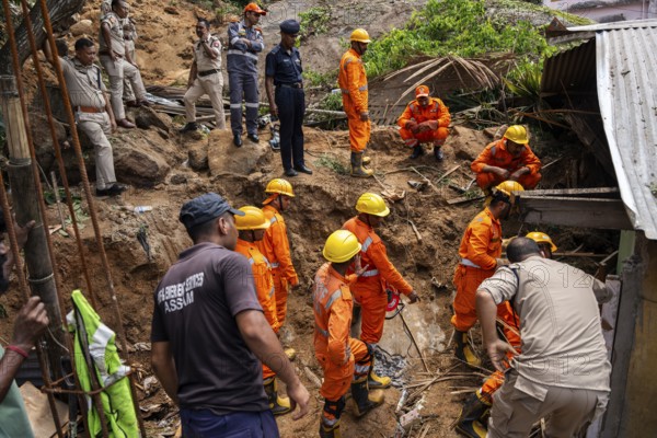 Rescue operations by the National Disaster Response Force (NDRF) and police are in full swing after a major landslide, triggered by a heavy downpour, in Guwahati, India, on June 7, 2025. One person was reported missing in thr landslide and two houses damaged, Asia