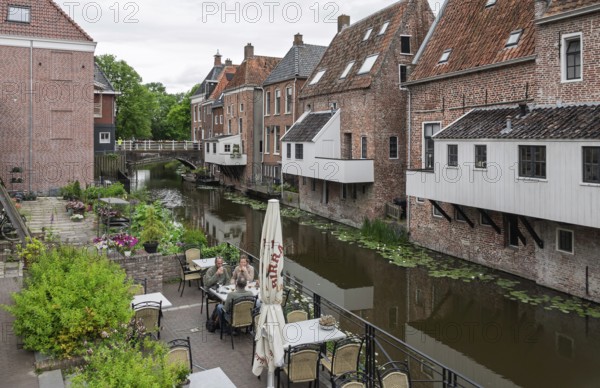 Hanging kitchens above the Damsterdiep in the historic town of Appingedam, province of Groningen, Netherlands
