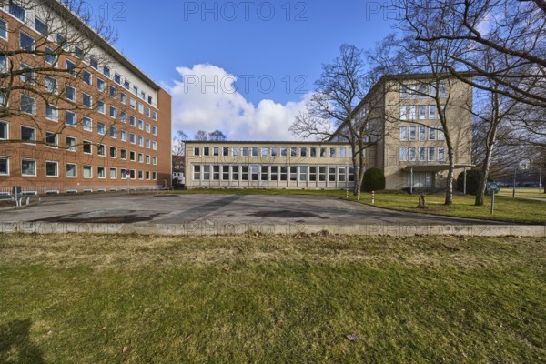 Lower Saxony Ministry for Social Affairs, Labour, Health and Equality, tax office Hannover-Mitte, brick building, bare winter trees, lawn, blue sky, cumulus clouds, Hanover, state capital, Hanover region, Lower Saxony, Germany, Europe