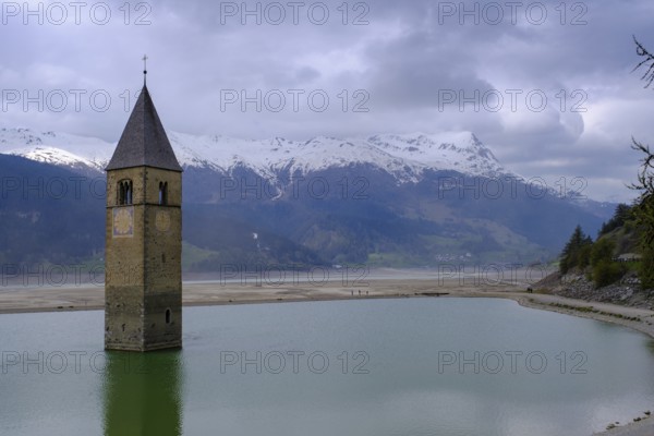 Bad weather at the church tower of Altgraun in Reschensee, Reschenpass, Vinschgau, South Tyrol, Italy, Europe