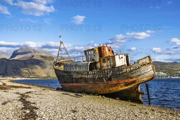 Corpach Wreck or Old Boat of Caol and Nevis Range Mountains, Caol Beach, Corpach, Fort William, Highland, Scotland, UK