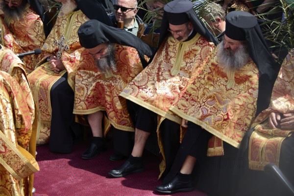 Orthodox priests in elaborate golden robes sit in the middle of a crowd during a ceremony, Orthodox ceremony, monks of St John's Monastery, ceremonial washing of feet, procession, Maundy Thursday, Megali Pempti, Chora, Patmos, Dodecanese, Greek Islands, Greece, Europe