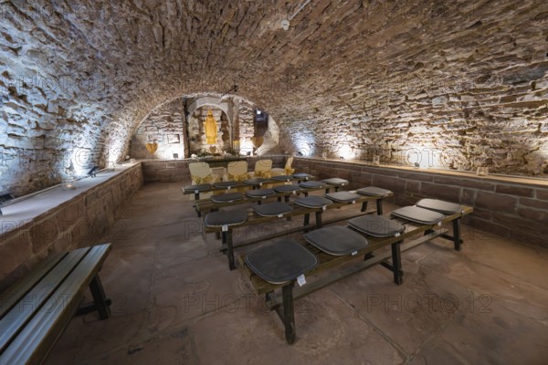 Stone vaulted cellar with benches and warm light, rustic and historic atmosphere, registry office, family celebration in Neubulach, district of Calw, Germany, Europe