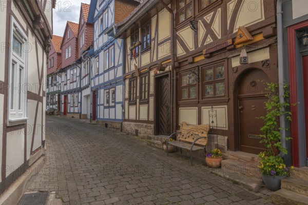 Bad Sooden, Allendorf, Allendorf district, historic old town with numerous half-timbered houses under monument protection, gabled houses, play street sign, bench with musical notes, flower pot, cobblestones, Werra-Meissner district, Hesse, Germany, Europe
